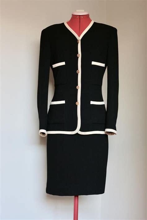 legendary chanel suit with collarless jacket and well-fitted skirt|chanel suit for women.